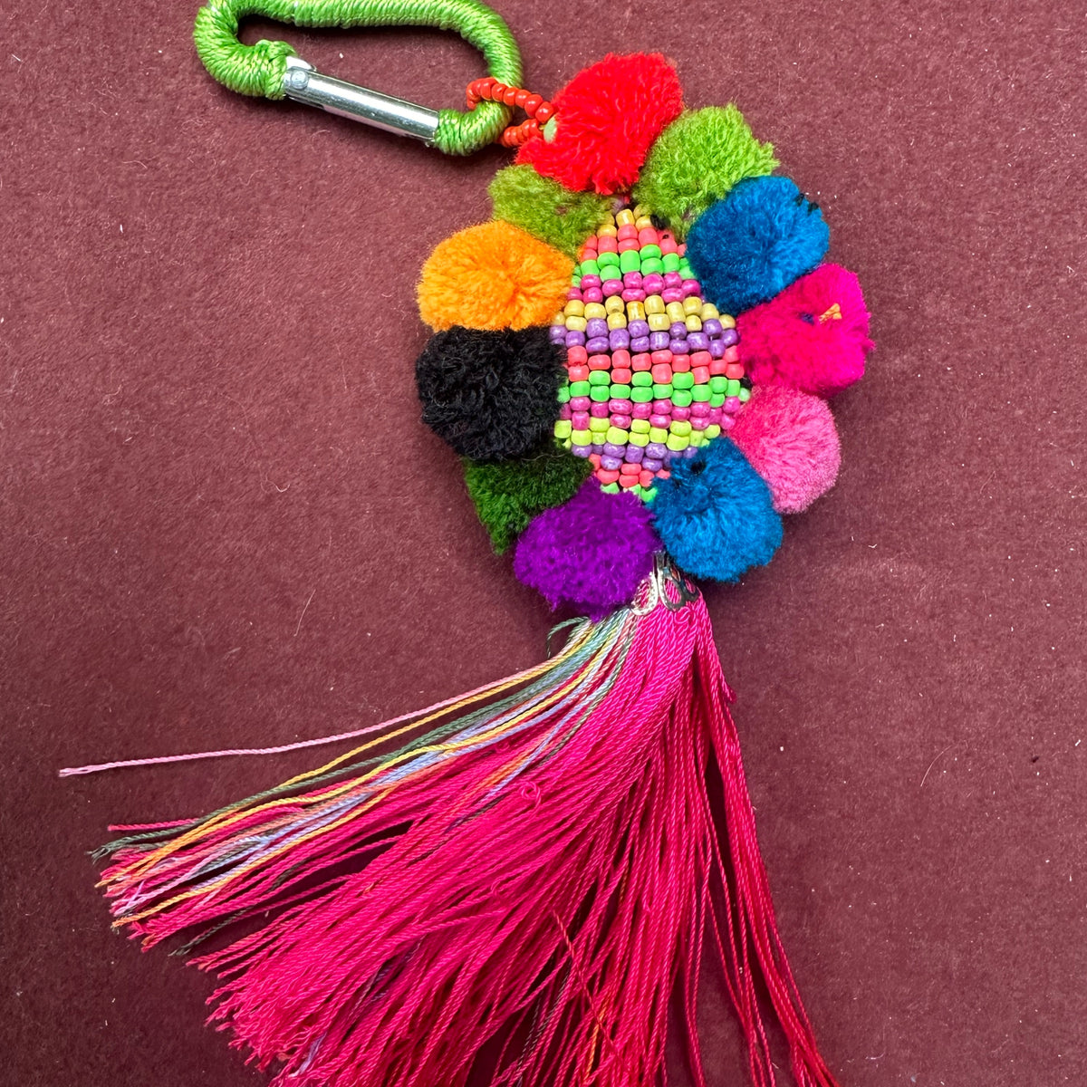 Multi pom pom key ring with pink tassel